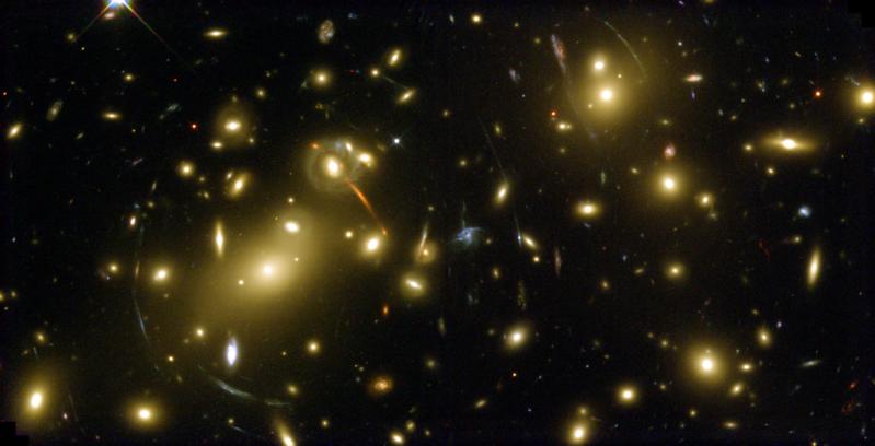 NASAHubble's tweet photo. #HubbleClassic This massive galaxy cluster, Abell 2218, acts like a giant zoom lens in space. Its gravitational field magnifies the light of more distant galaxies far behind it, providing a deep probe of the remote universe. Hubble captured this image 18 years ago this month. https://t.co/QeVe1McKng