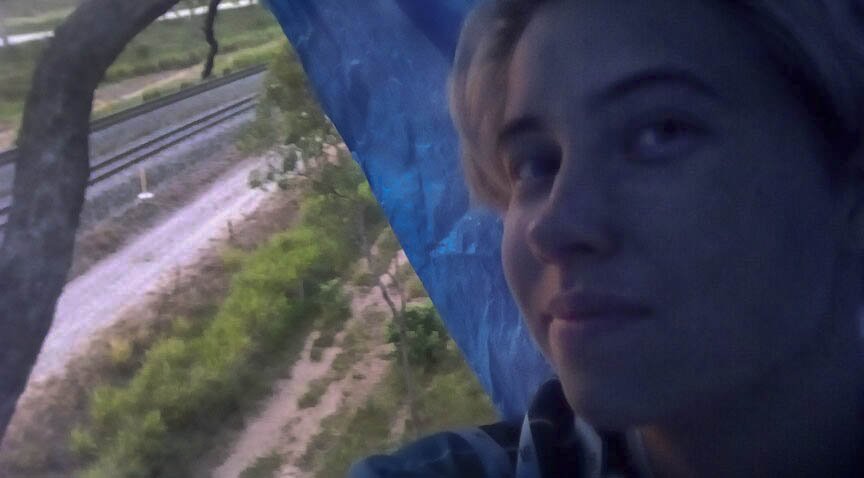 FLACCoal's tweet photo. Tayla Jay Haggarty, 23 from Brisbane has halted @Aurizon_ coal trains to Adani’s Abbot Point Terminal this morning. She expects Queensland Government to adhere to their promise to “veto public funds that enable Adani mine, rail..”#BlockadeAdani #StopAdani https://t.co/69eY0QDScx https://t.co/TYY1UaiPme