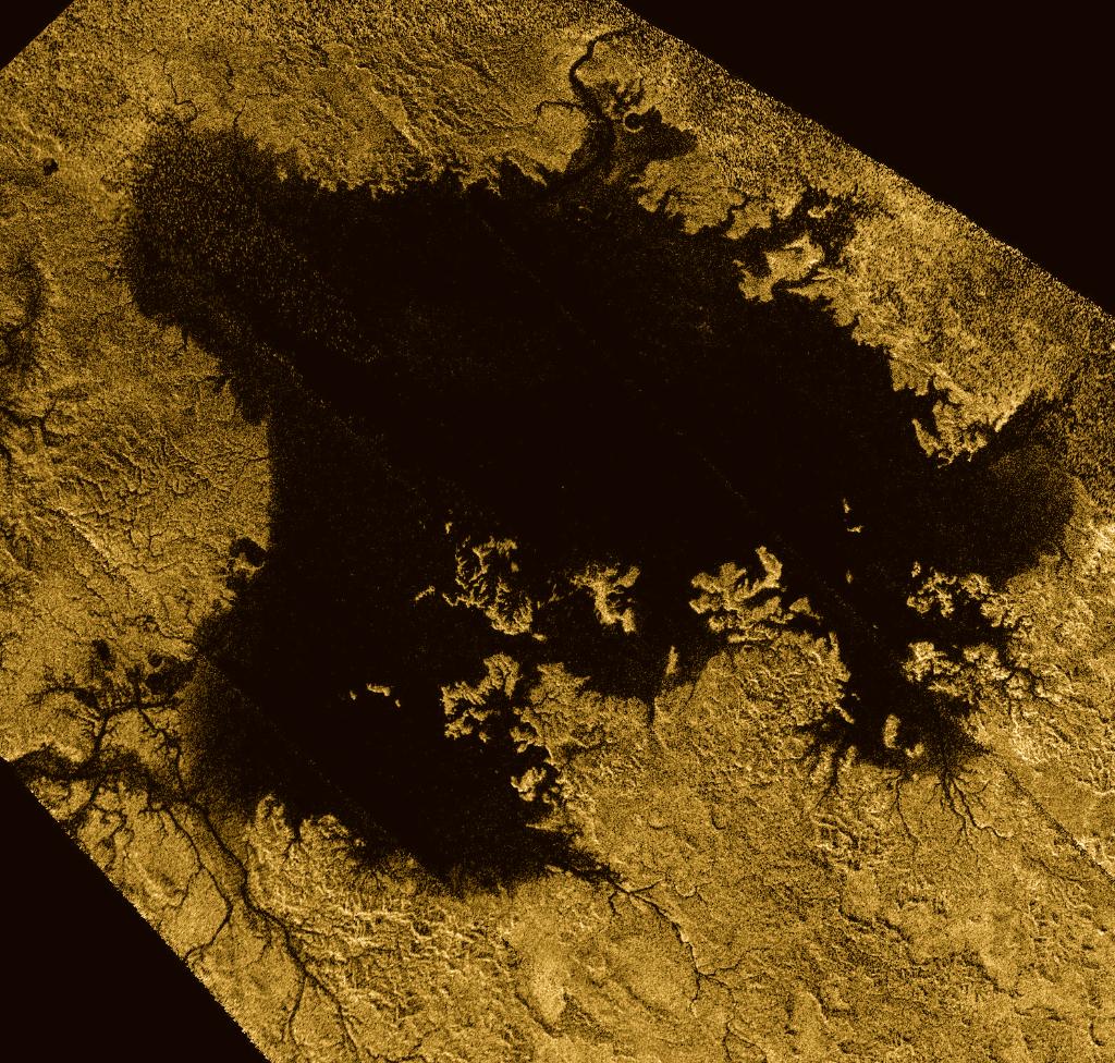 NASA's tweet photo. Saturn’s moon Titan may be nearly a billion miles away from Earth, but data from our @CassiniSaturn spacecraft reveals a new way this distant world &amp; our own are eerily similar: both have sea level, meaning the surface of oceans lie at an average elevation https://t.co/K4R7BSTN5T https://t.co/SANbhhPFBu
