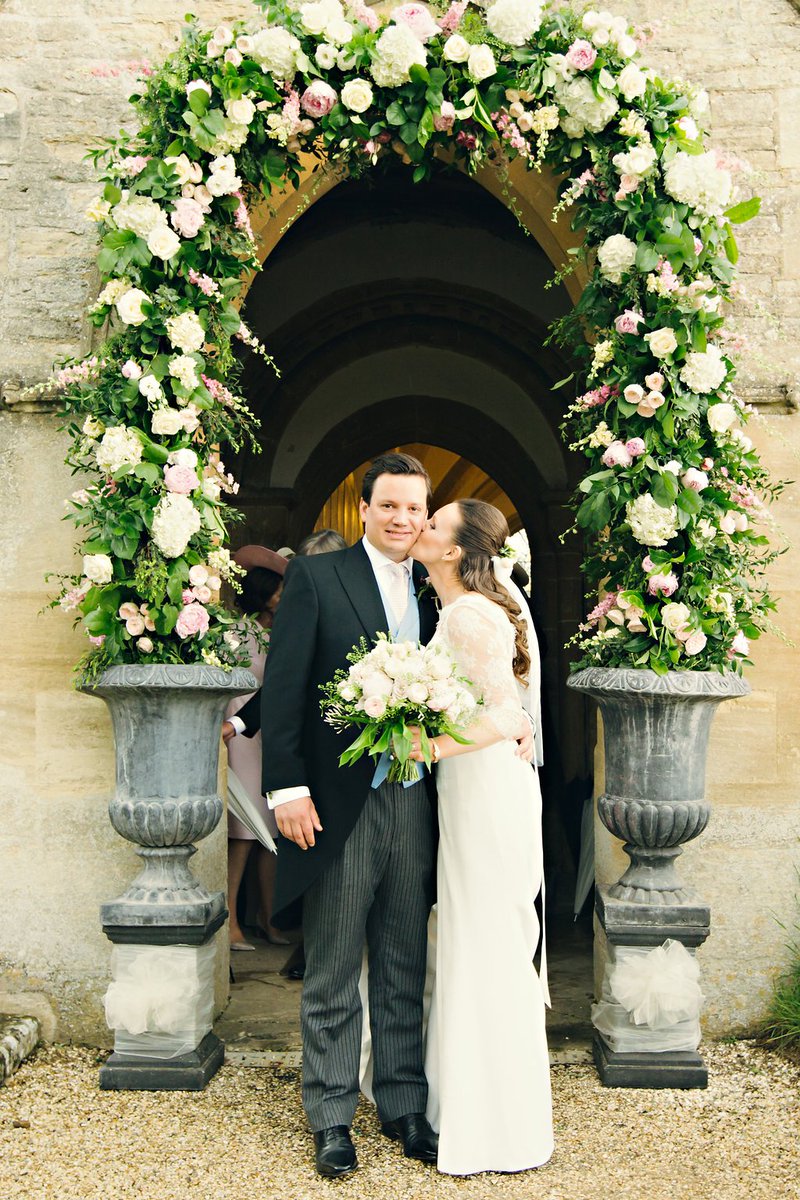 Classic pink and ivory flowers from Lydia and Ben's beautiful Oxfordshire wedding last spring featuring two stunning flower arches.  The perfect way to decorate the entrance to the church and the top of the aisle.