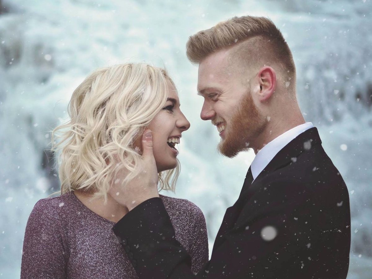 thisisinsider's tweet photo. A couple posed by a frozen waterfall for their engagement photos, and the pictures are so beautiful they'll give you chills ❄️ https://t.co/jlZHCbWrdm https://t.co/42T42V66Wt