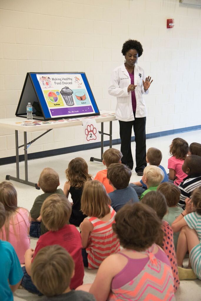 MSUShelterMed's tweet photo. It's the #PeakOfTheWeek- Did you know that early childhood education programs like #AnimalsInFocus help prevent achievement gaps and improve long-term health effects? Community outreach veterinarian, Dr. Brittany Moore-Henderson, has just the game to help engage these kids! https://t.co/W0YiJaWpF8