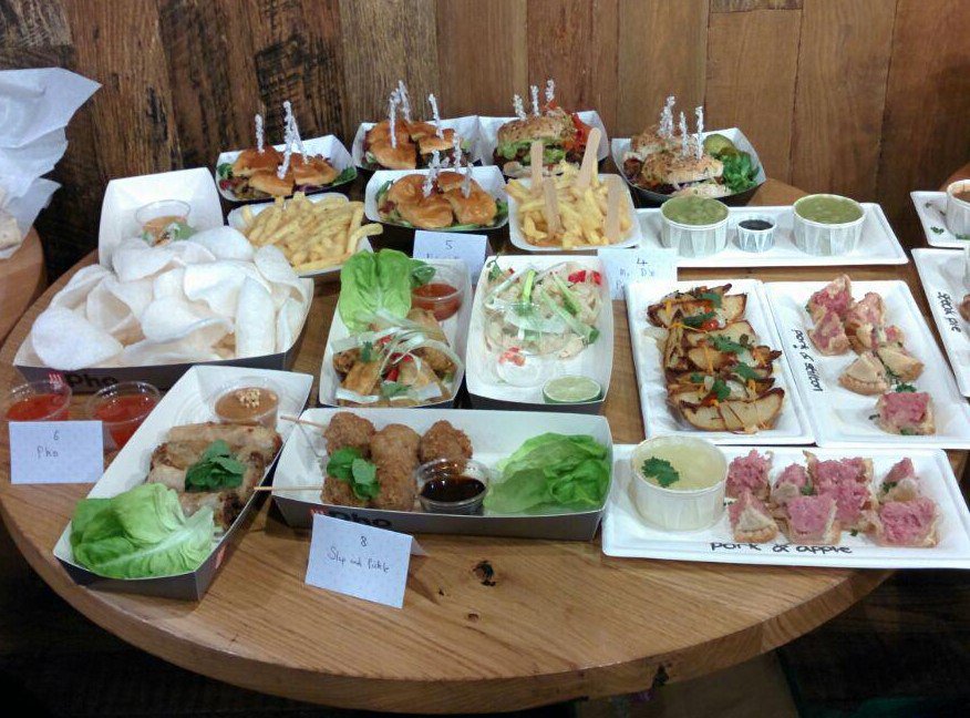 LUUFoodSoc's tweet photo. Table 2: Featuring @PhoRestaurant (for their amazing Vietnamese sides), @NellysBarn (for their ridiculously good cheesy burgers and chips) and @MrDsPieMachine (for the obvious: pies!) #TrinityKitchen #LUUGIAG https://t.co/pD1FxoKhST