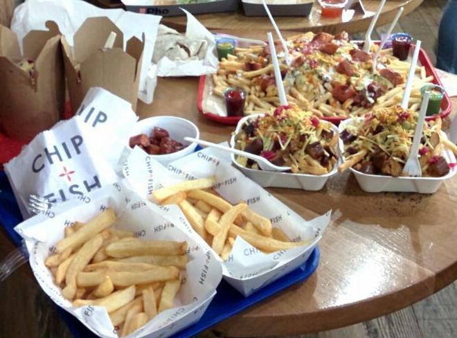 LUUFoodSoc's tweet photo. Table 1: Featuring @slapandpickles (with their hot dog loaded fries), @DucknRoll_CG (also Fish and Chip) and @TroughStreetFood (with their delicious pulled pork) @TrinityLeeds#LUUGIAG https://t.co/r1HSaK9hVY