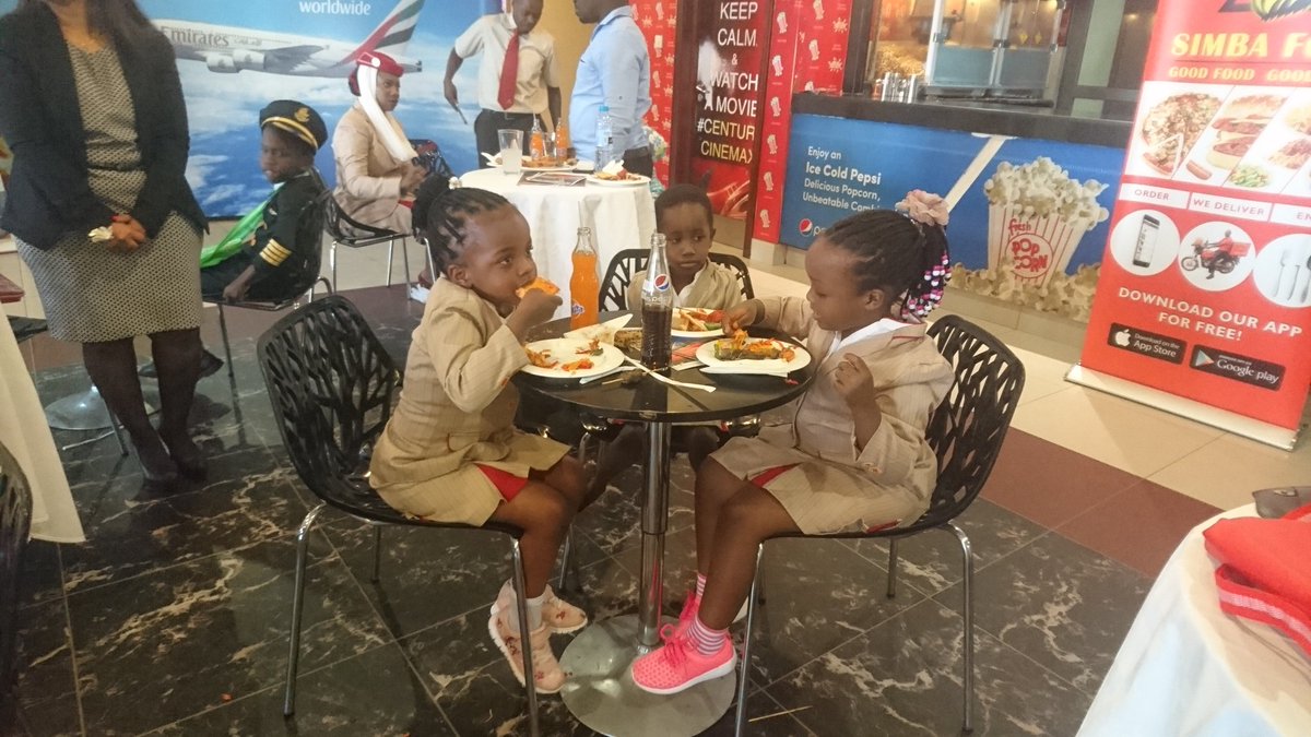 Guide2Uganda's tweet photo. Meal times on board are also given extra attention on @emirates flights. The special meals offered to children aged between two &amp; 12 years old are served on newly designed meal trays featuring the iconic Emirates cabin crew and pilots #EmiratesFlyWithMe https://t.co/Uto5POcldj