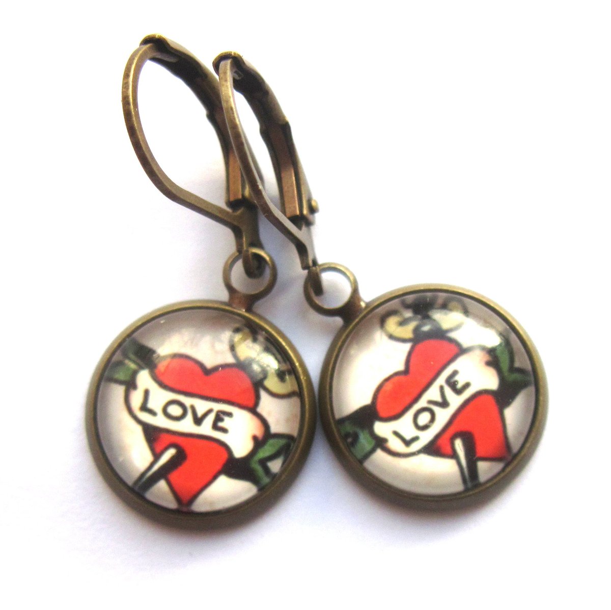 GimmeThatThing's tweet photo. New kitsch! Love Tattoo #earrings in Glass n Brass https://t.co/MCiTk9cuTX @Etsy #tattoo #valentinesdaygifts #jewelry #fashion #HeartEarrings https://t.co/n6bTuO6vC5