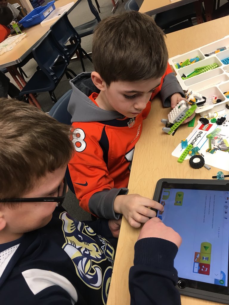 Ms_McLellan's tweet photo. West Elementary STEM Club students show off their coding and programming skills with their @lego WeDo 2.0 robots. Tonight they created robots with motion sensors &amp; robotic cooling fans, both controlled through the iPads via programs they created! #westelementarystem #legowedo20 https://t.co/33K9m12K4Q