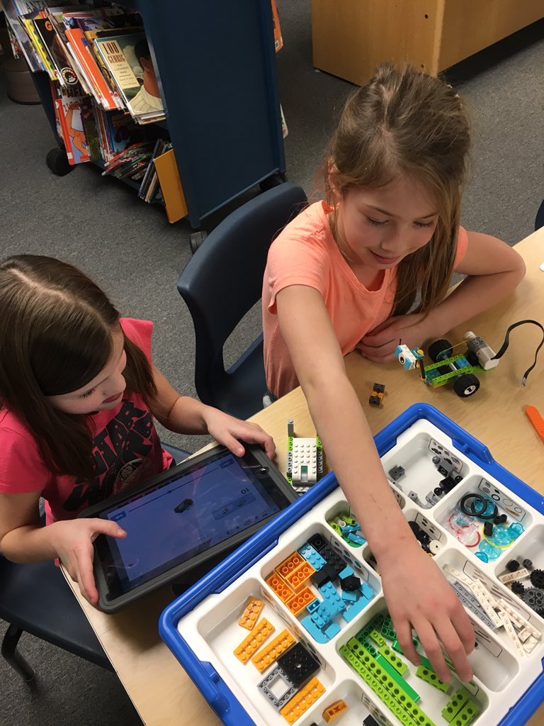 Ms_McLellan's tweet photo. West Elementary STEM Club students show off their coding and programming skills with their @lego WeDo 2.0 robots. Tonight they created robots with motion sensors &amp; robotic cooling fans, both controlled through the iPads via programs they created! #westelementarystem #legowedo20 https://t.co/33K9m12K4Q