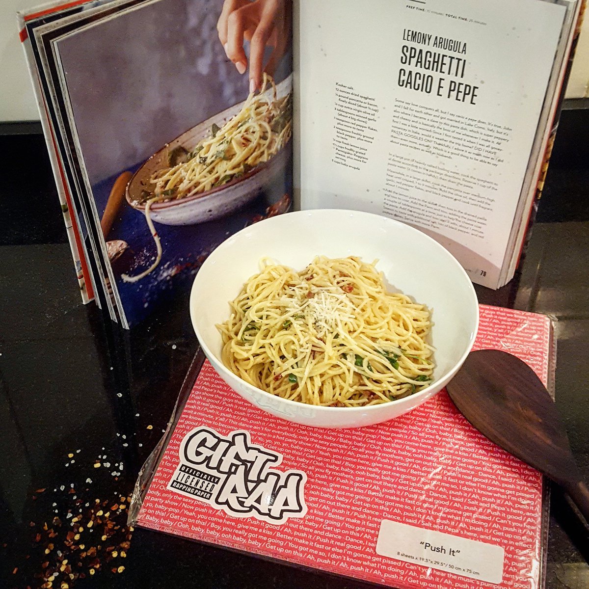 HeatherBurns's tweet photo. How to sneak @GetGiftRap into @chrissyteigen's feed? Buy #Cravings, find an easy-ish recipe due to personal culinary shortcomings, make (delicious!) pasta, take photo (with Gift Rap in "Push It" - obvi, due to upcoming labor), and then eat (delicious!) pasta. https://t.co/fPyFYdlNkY
