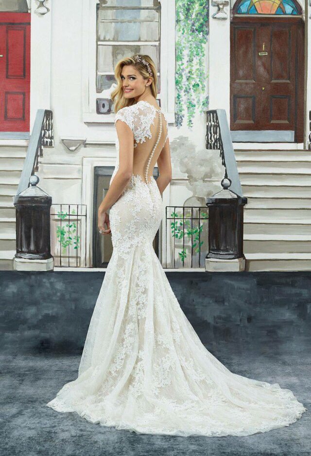 If you're going to have everyone looking at your back when you say your vows, make sure you give them something to talk about. The back on our Ellen gown is simply divine…