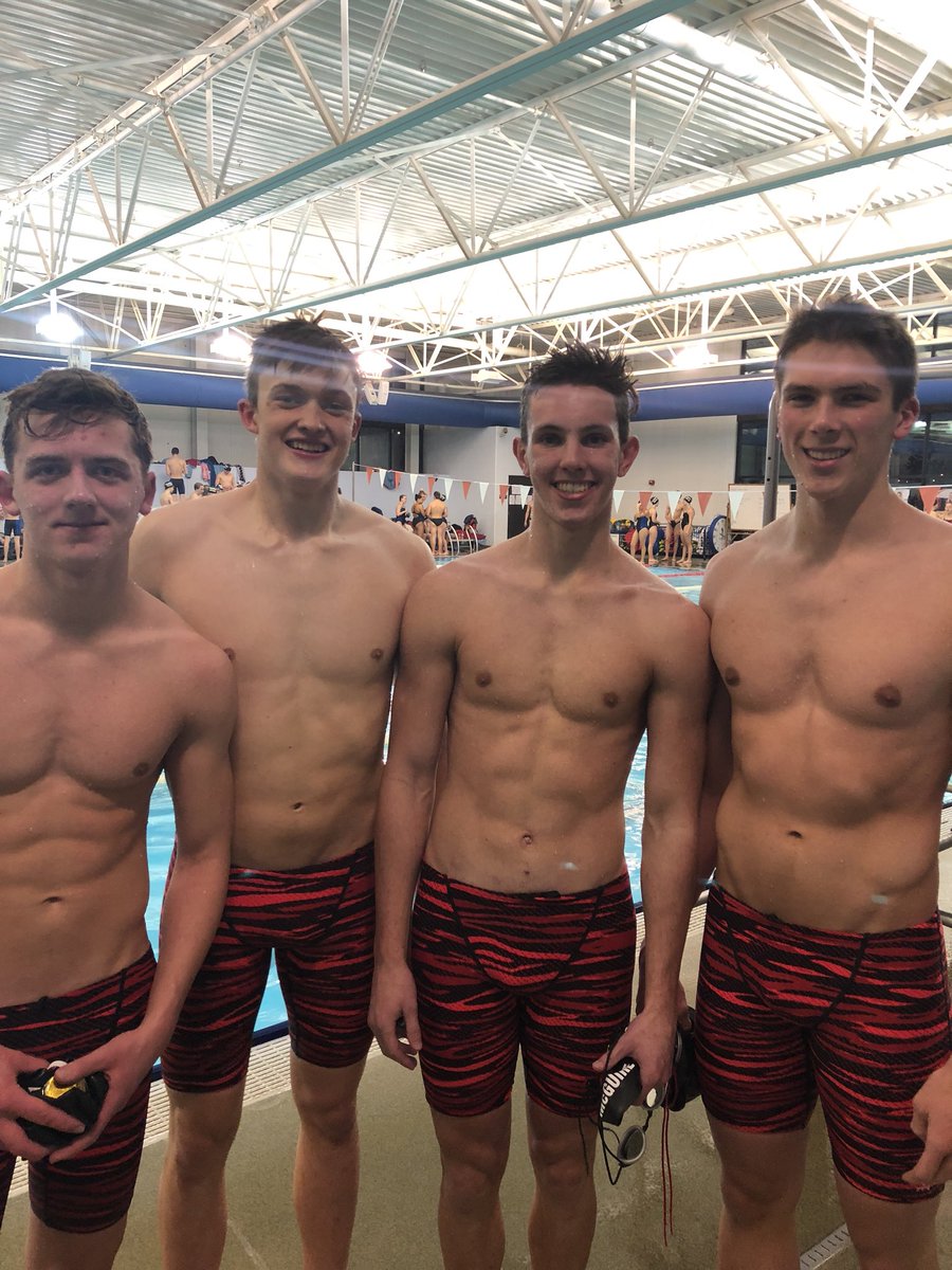 Scott, Dylan, Gage and Logan team up to win the 200 freestyle relay.