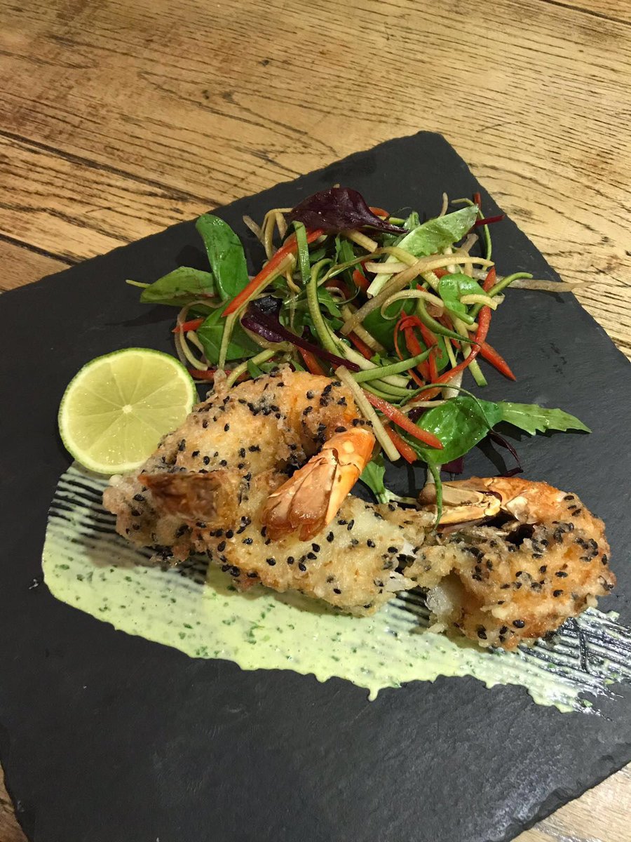 We're serving up some Fish Friday specials today. How about these coconut and black sesame prawns with a Thai green aioli and an Asian salad on the side?