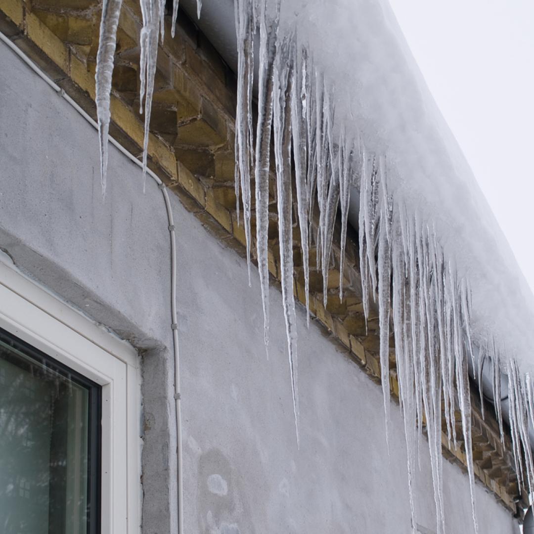 Remove ice dams from low-pitched roofs and gutters to avoid water seeping into your foundation come spring.