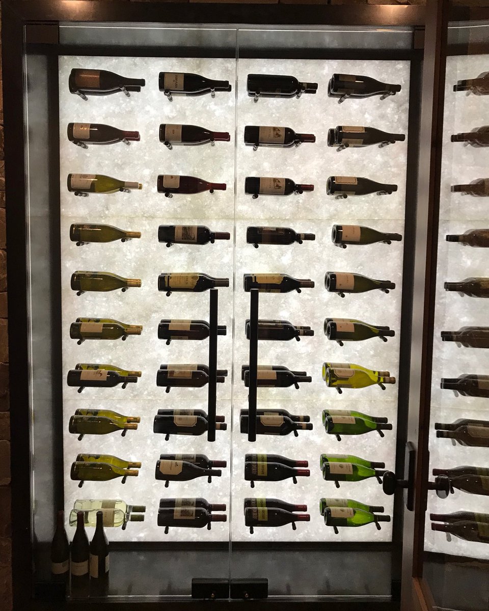 eedesigncenter's tweet photo. This Opal White polished marble is a gorgeous example of how to utilize this stunning slab and think beyond its traditional use. #earthelements #imagineletscreate #opalwhite #marble #backlit #winerack https://t.co/s2kDs5XgHe