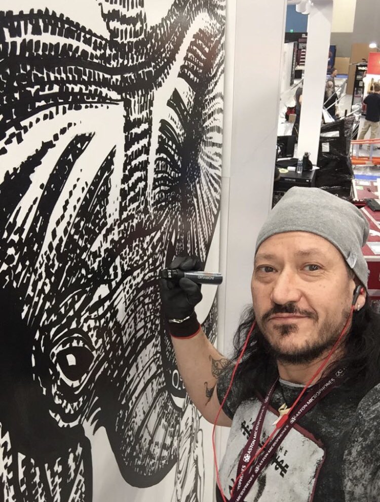 LVNG_heart's tweet photo. LVNG Group Co-Founder &amp; artist Ant killing it in Cali at @NAMMShow with clients @Aston_Mics creating a living art installation - stand 18705 https://t.co/AhIfj9fhEz