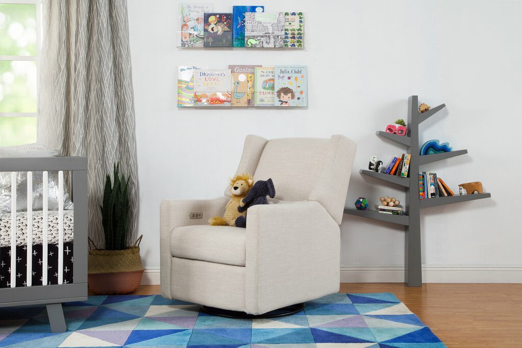 🥝 #kiwiglider 🥝
From <a href="/babyletto/">Babyletto</a> is now available! This electronic rocker and recliner comes equipped with its own USB port! Did we mention we’re never getting up from this chair again?! 

#nurseryinspo #babyfurniture #nursingchair #babyletto #juvenileshop