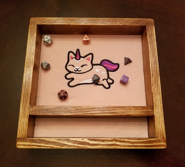 Hear ye, hear ye! In three days time (Feb 1st), EmbroiderWood will be gifting one lucky adventurer a free, custom Legendary Dice tray! To complete this quest and have a chance at procuring this Legendary loot, all you have to do is re-tweet this missive and follow us!