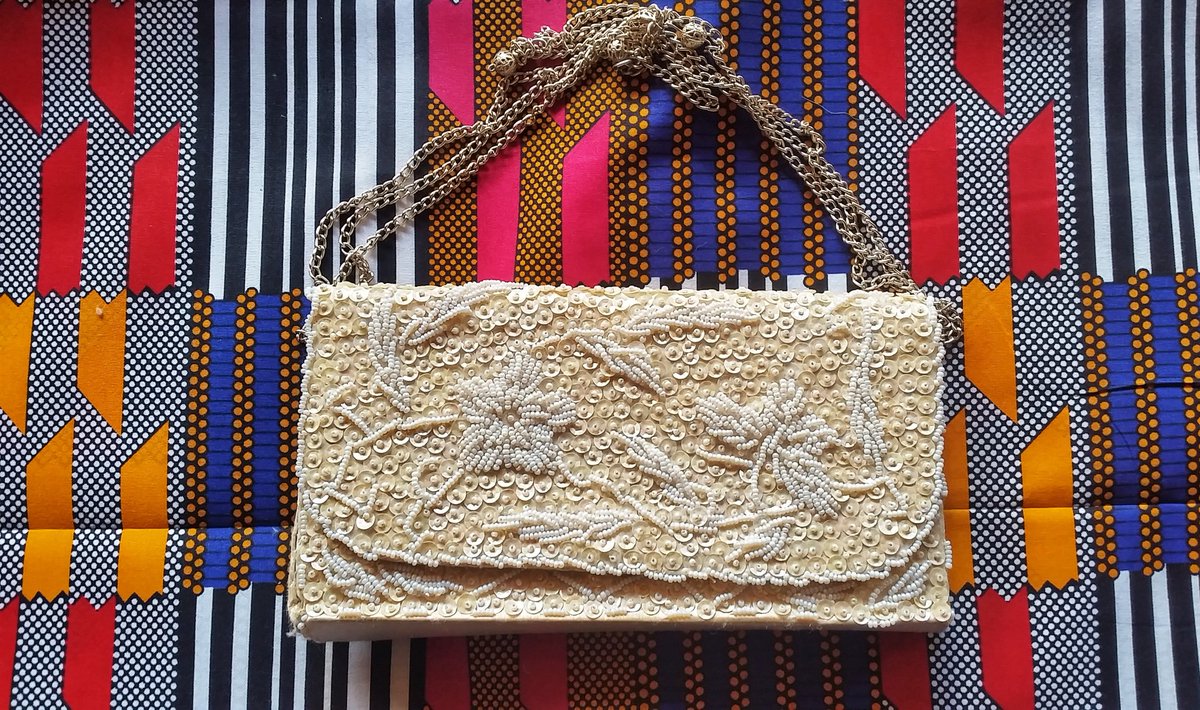 kpczim's tweet photo. Wedding handbag. The chain's broken now after being played with and some of the sequins have come off. Still love it. #Snapdecisions (handbag and husband) https://t.co/rRAyazjujh