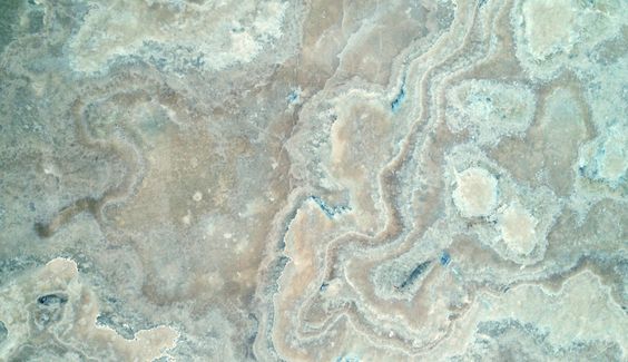 The kitchen island in project Esra is made from locally sourced blue onyx whose swirling, rippling pattern echoes the watery outlook. #1508london #interiordesign #localinspiration