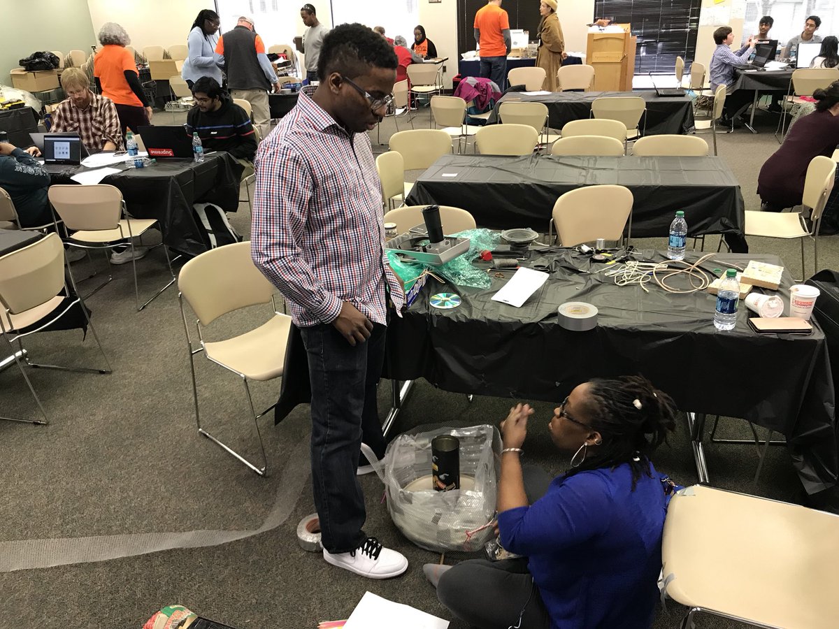 josuefalaise's tweet photo. Look @HunyFade2Black work with her son to develop their prototype @TMCCCHack. #TMCCCHack https://t.co/UT27u9HXN0