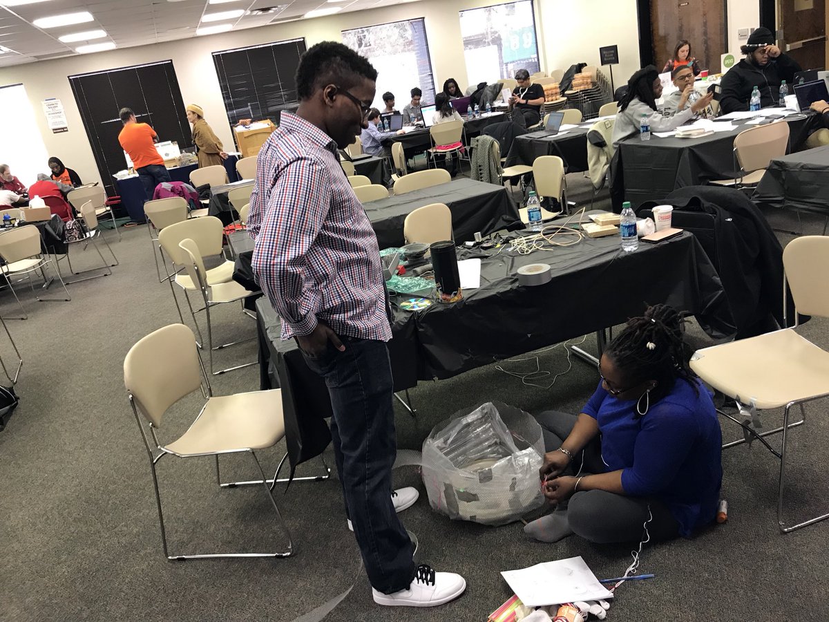 josuefalaise's tweet photo. Look @HunyFade2Black work with her son to develop their prototype @TMCCCHack. #TMCCCHack https://t.co/UT27u9HXN0