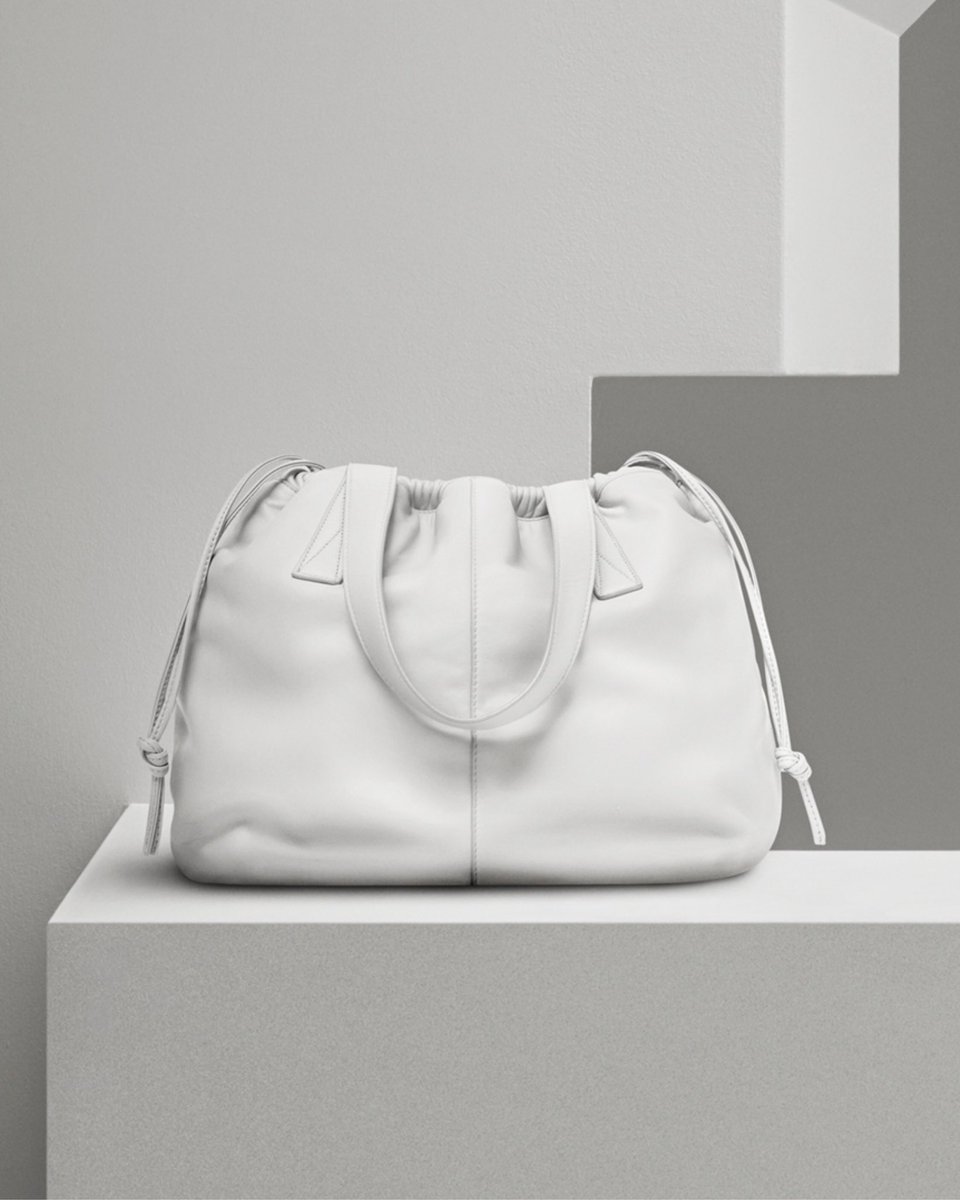 victoriabeckham's tweet photo. The Helmet Bag is reversible and available now in an array of colours at https://t.co/HnD2u2z296 and at 36 Dover Street, London. #VBPreSS18 #VBDoverSt https://t.co/7yvruEAgLO