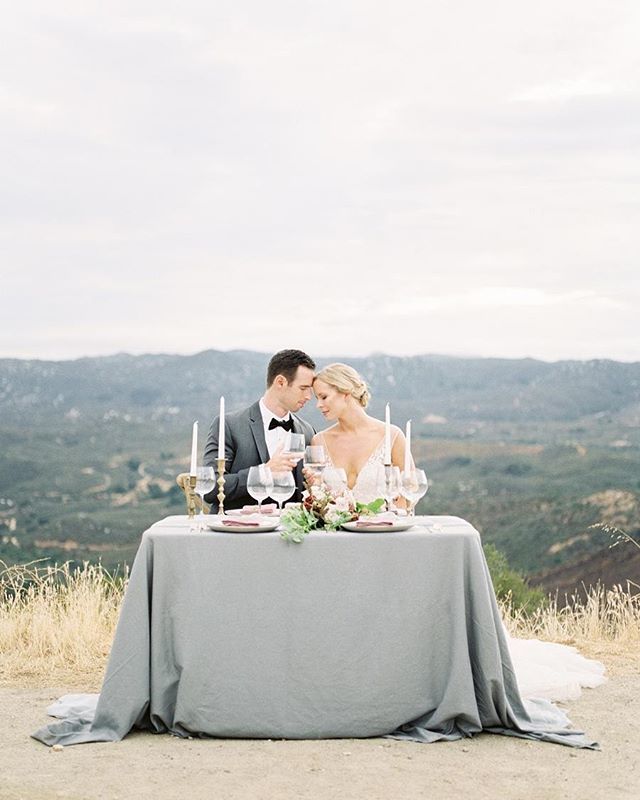 Cheers to this beautiful view! 🥂 As featured on <a href="/weddingsparrow/">Wedding Sparrow blog</a> || Planning: @justakissweddings | Photography: @savanphotography | Rentals: @sweetsalvagerentals | Attire: <a href="/enaurabridal/">Enaura Bridal</a> <a href="/stitchandtie/">Stitch And Tie</a> | Florals: @wildsageflowers | Hair and Makeup: @kaylaarielleartistry Paper g…