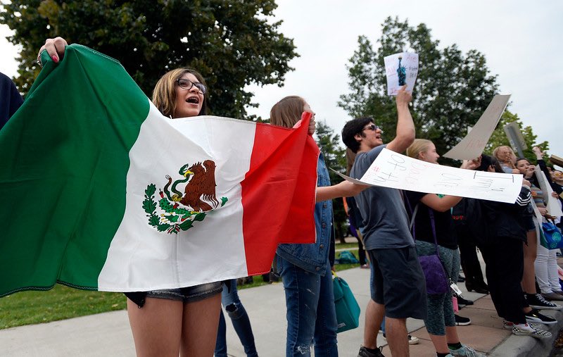 tabberg's tweet photo. I am trying to understand the message when immigration/DACA protestors demand US citizenship while carrying flags from Mexico or other countries?? #ConfusedMessage https://t.co/STivdnDTzU