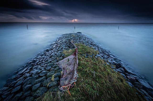 I remember this shot well, returning to the same spot I enjoyed my first #landscapephotography #workshop  and being greeted by this iconic image. Well worth the soaked clothes and the rain caught me on the way back! #stavoren #ijsselmeer #stormyweather #longexposure #fishing…