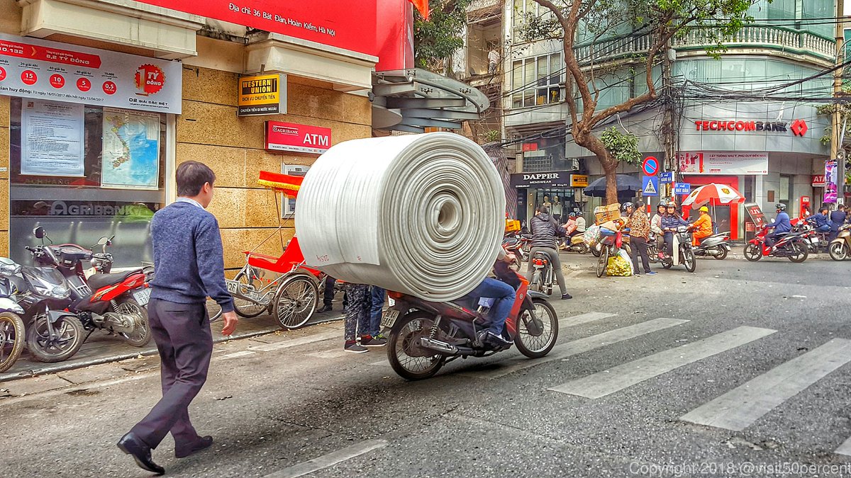 PHOTO FLASHBACK: Hanoi, Vietnam 

Slowly going through the thousands of photos I've taken during my 15 months of travel &amp; came across this one.

I was impressed with how people could transport almost anything on their bikes.

And no, that isn't a giant roll of toilet paper! 😁