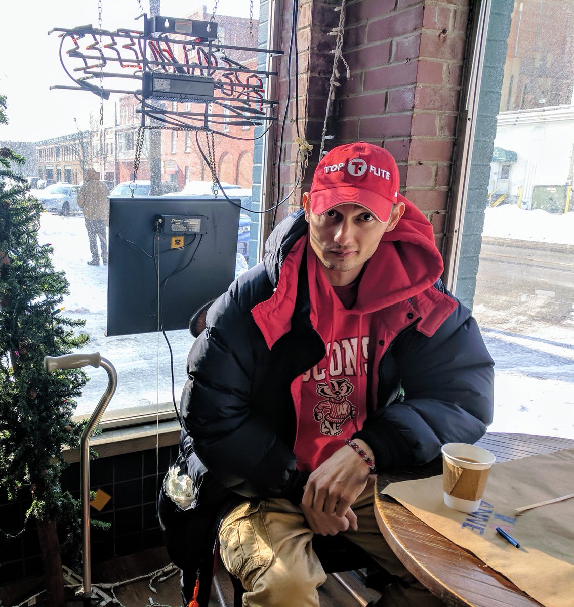 CCNEOhio's tweet photo. After Howard helps to display his art, he is spotted enjoying a specially prepared cup of @ScribblesCoffee https://t.co/AnMUy2yfnt
