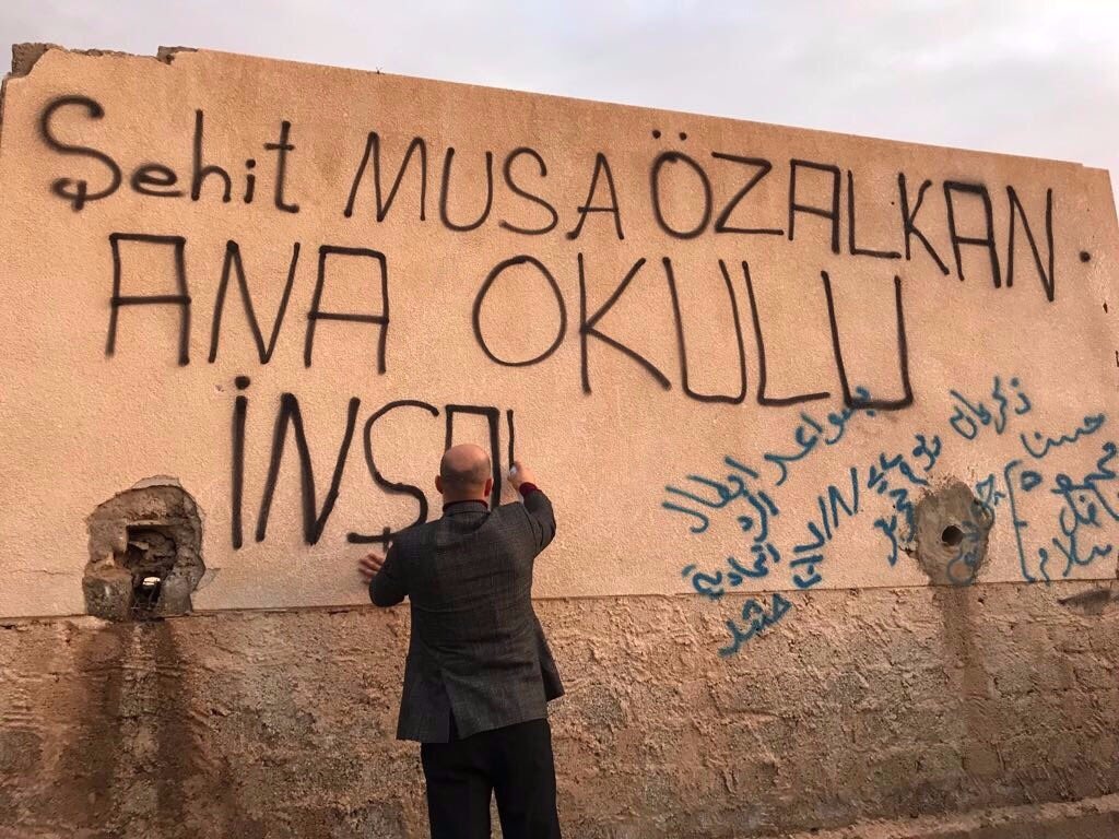 kazimerdiaktunc's tweet photo. Şehidimizin vasiyeti üzerine Liderimiz Sn #DevletBahçeli beyin talimatları "Telafer Şehit #MusaÖzalkan Anaokulu" için ile Bismillah diyerek ilk kazmayı vurduk. https://t.co/o0HwhL7rg3