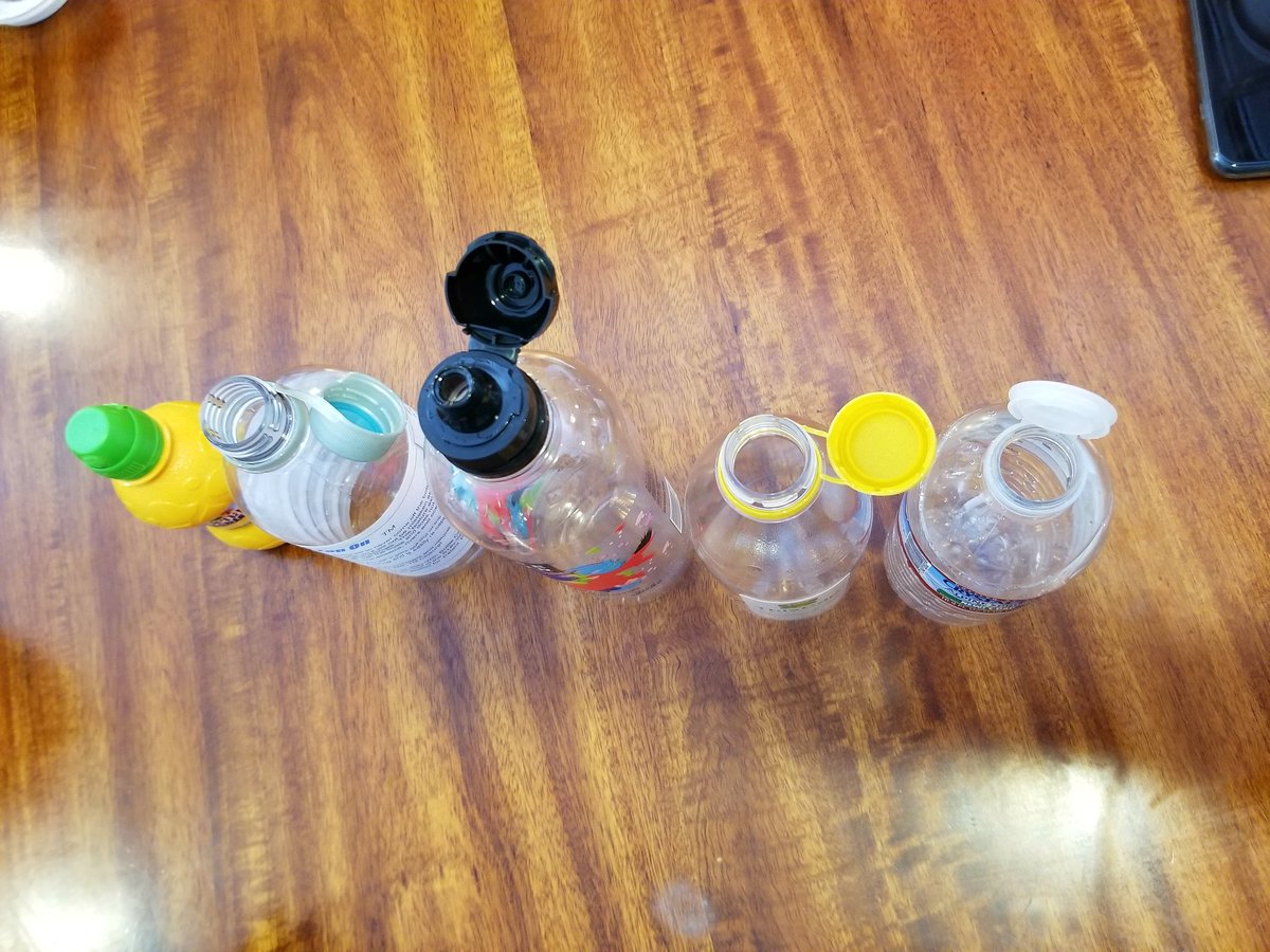LloydLevine's tweet photo. @AsmMarkStone 5 different bottles, 5 different caps, one thing in common...they're all tethered to the bottle.  #AB319 https://t.co/ti0fAS6Vsx