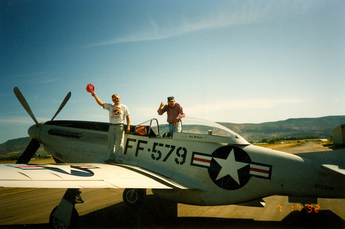 HeberAirport's tweet photo. Russ McDonald and friend getting ready to fly his P-51 "Newf" at the @HeberAirport RussMcDonaldField in July 1992! #HeberCity #wasatchcounty #genav #KHCR https://t.co/o9WAsG5UVH
