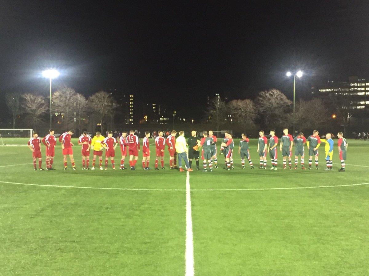 At the centre circle HMS Diamond on the left prepare to shake hands with HMS Queen Elizabeth’s Second team.