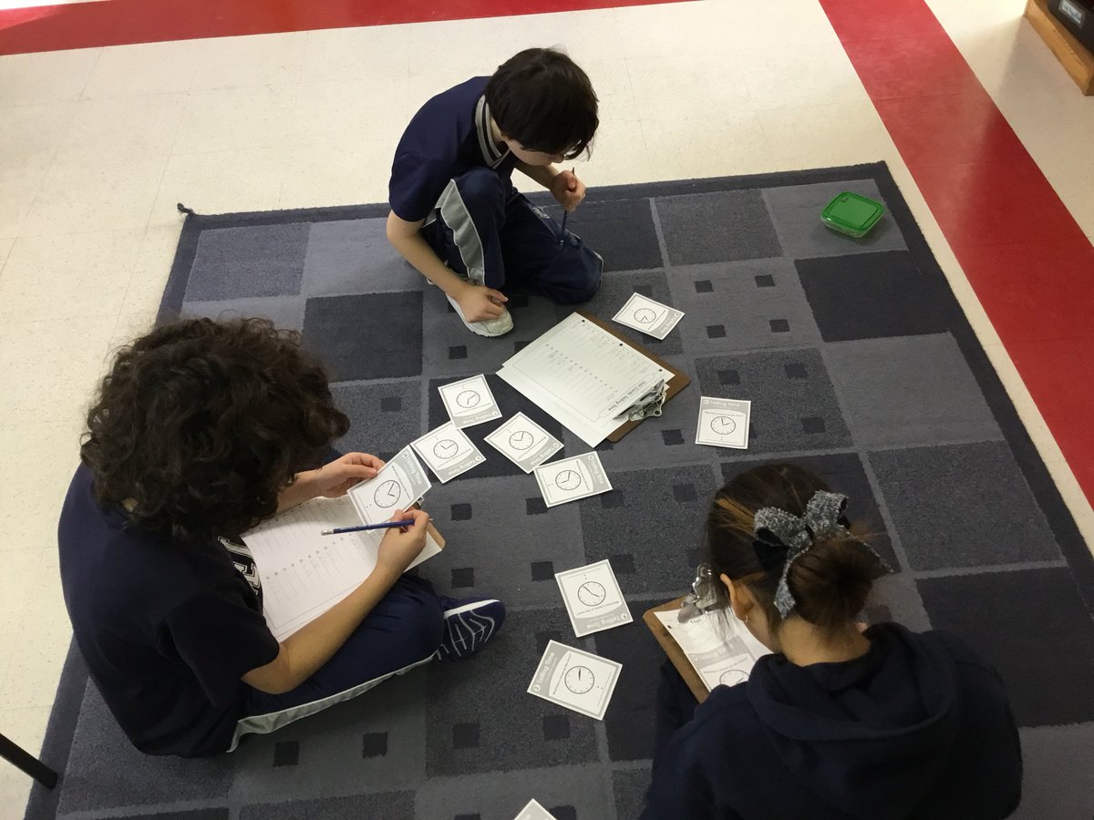 MsSpecksClass's tweet image. Just wandering the room?!  Nope, we are looking for #tellingtime task Cards that Mrs. Singleton hid on us!  #reallifemath #mathhunt #getupandmove