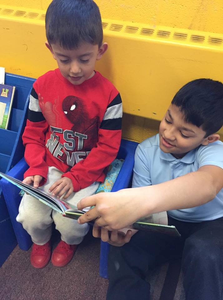 jpettykc's tweet image. The &quot;big kids&quot; came to spend time with the preschoolers during Catholic Schools Week. While there they helped us work on our literacy skills! #scpsi
