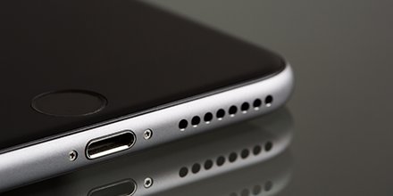 You can access the iOS symbol keyboard without swapping to it - tap and hold the 123 button and then slide to the symbol that you want to insert