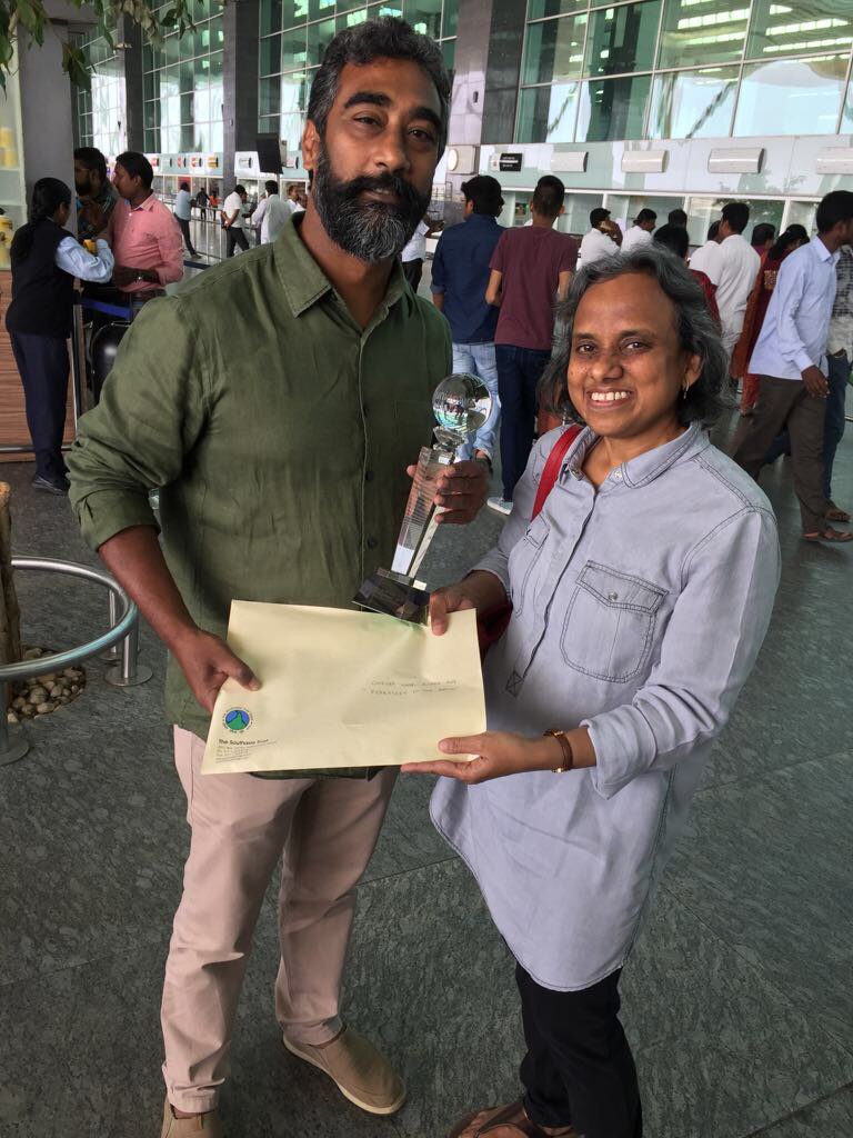 filmsouthasia's tweet photo. Director Chandrasekhar Reddy receiving The UNICEF Nepal Award for film that best portrays social/children’s issues awarded to his documentary "Fireflies in the Abyss" screened at FSA 2017! FSA Director Mitu Varma presented him the award in Bangalore. #fsa2017 #UNICEFNepalAward https://t.co/6wFJfMx3LO