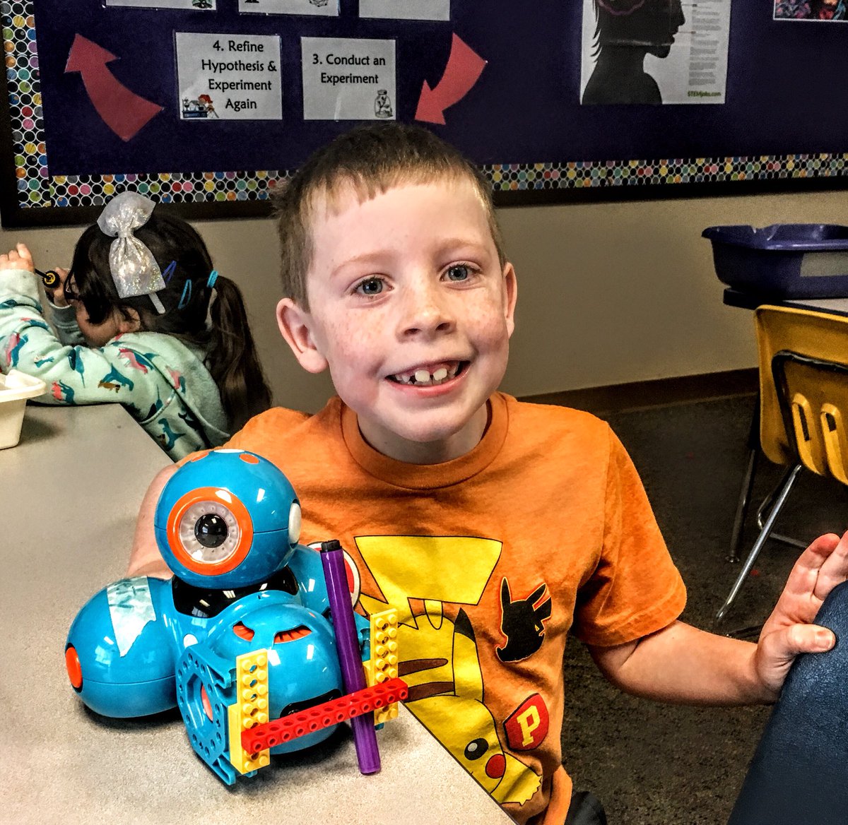 Teach_Innovate's tweet photo. 1st Graders are building contraptions on Dash to hold a marker as he drives. Next step will be to write code to make Dash draw a picture! #collaboration #CodeNewbie #edtech @WonderWorkshop #GoCIGo @STEAMrollerzMN #1stGrade #perseverance https://t.co/NVt1OPIq2j