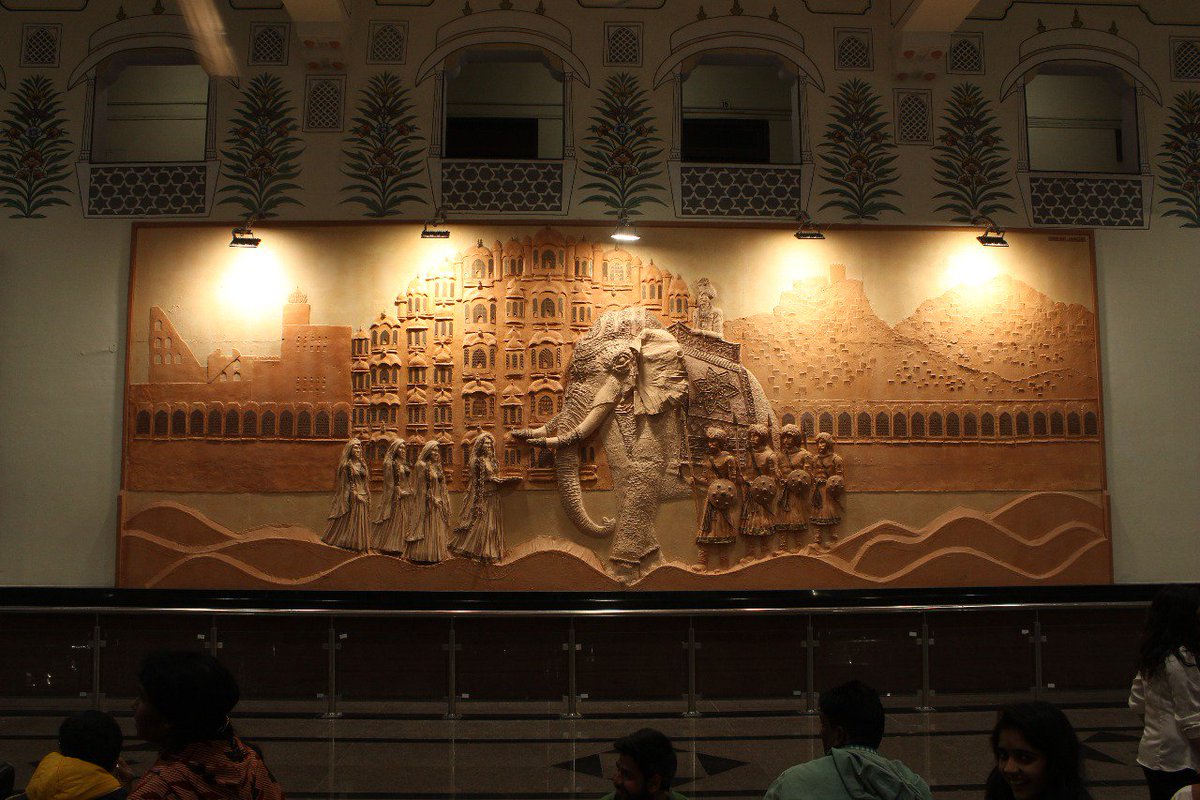 DespLnk's tweet photo. The newest selfie point in #Jaipur....The 384 sq ft 3D mural at the station concourse hall is a unique dry wall art sculpture by upcoming artist, Dinesh Jangid. Depicting a ceremonial procession, it is made with approx 700kg of putty and white cement sculptured on a plywood base. https://t.co/GZ9zSKGb8y