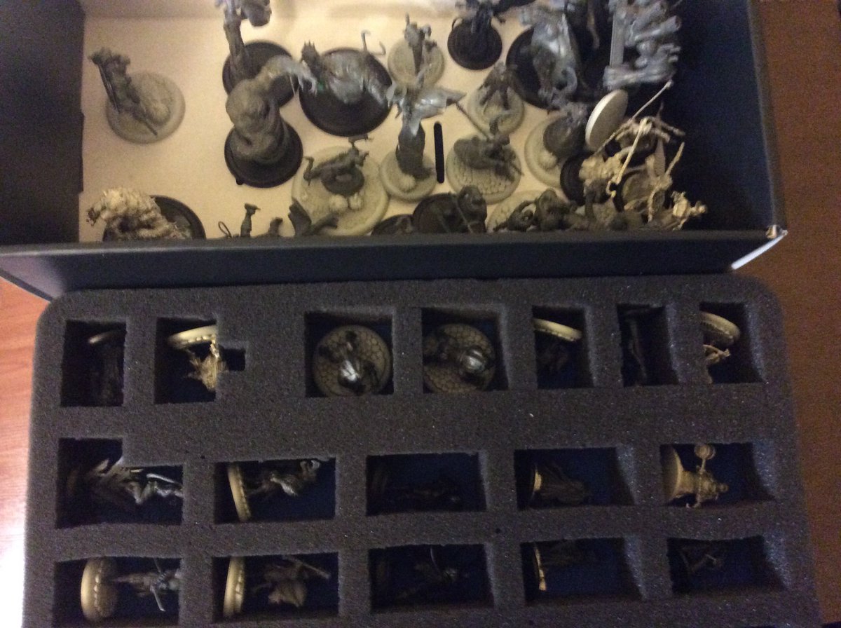 #hobbystreakday70  Fun with pluck foam!  Had to get my mess of Malifaux models into trays.  Halfway through, I found my box with the rest of my un-trayed models.  Got a bunch done.  #hobbystreak