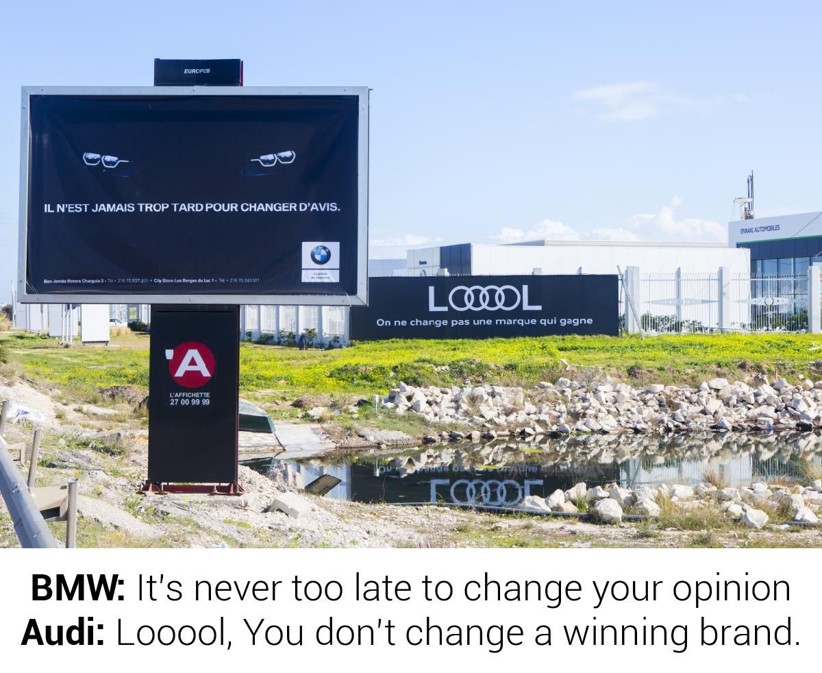 Ad World Masters Brands War Never Ends In Tunisia Bmw Installed An Outdoor Banner In Front Of Audi S Showroom And Audi Checkmated It Marketing Creative Advertising Brandswar Bmwvsaudi Audivsbmw