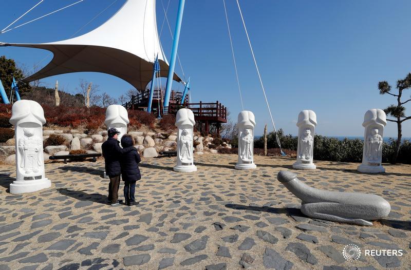 Reuters's tweet photo. South Korea's 'penis park' draws curious crowds of visitors from the nearby #PyeongChang2018 Winter Olympics https://t.co/jlX4wZgrTT @pearswick @HeekyongYan | More from the Winter Olympics: https://t.co/zTGOlsJc7S https://t.co/wxiZH8Sryb