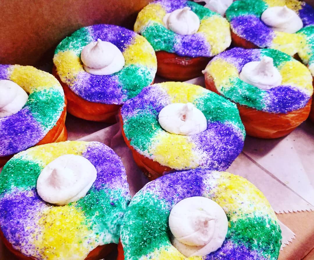 VantMarketing's tweet photo. Stuffing our face this morning with @NaegelinsBakery #KingCake doughnuts. Happy #FatTuesday! #MardiGras #VantMarketing #DigitallyPropelled https://t.co/jF0V57EXMK