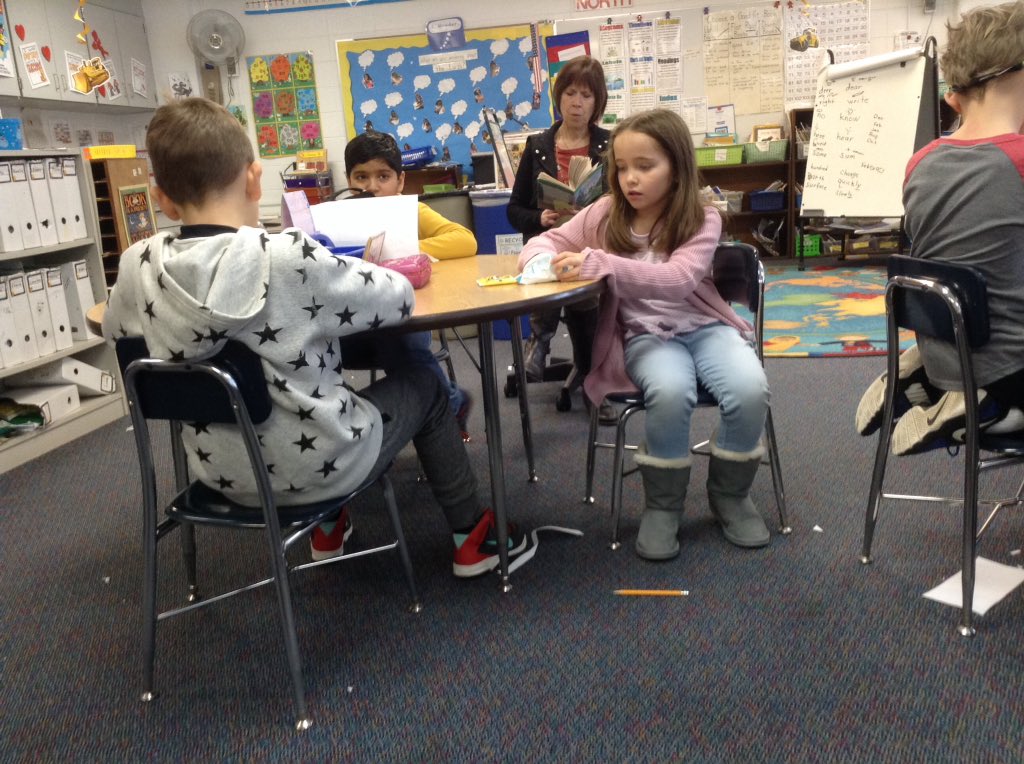 Its snack time and the teachers reading