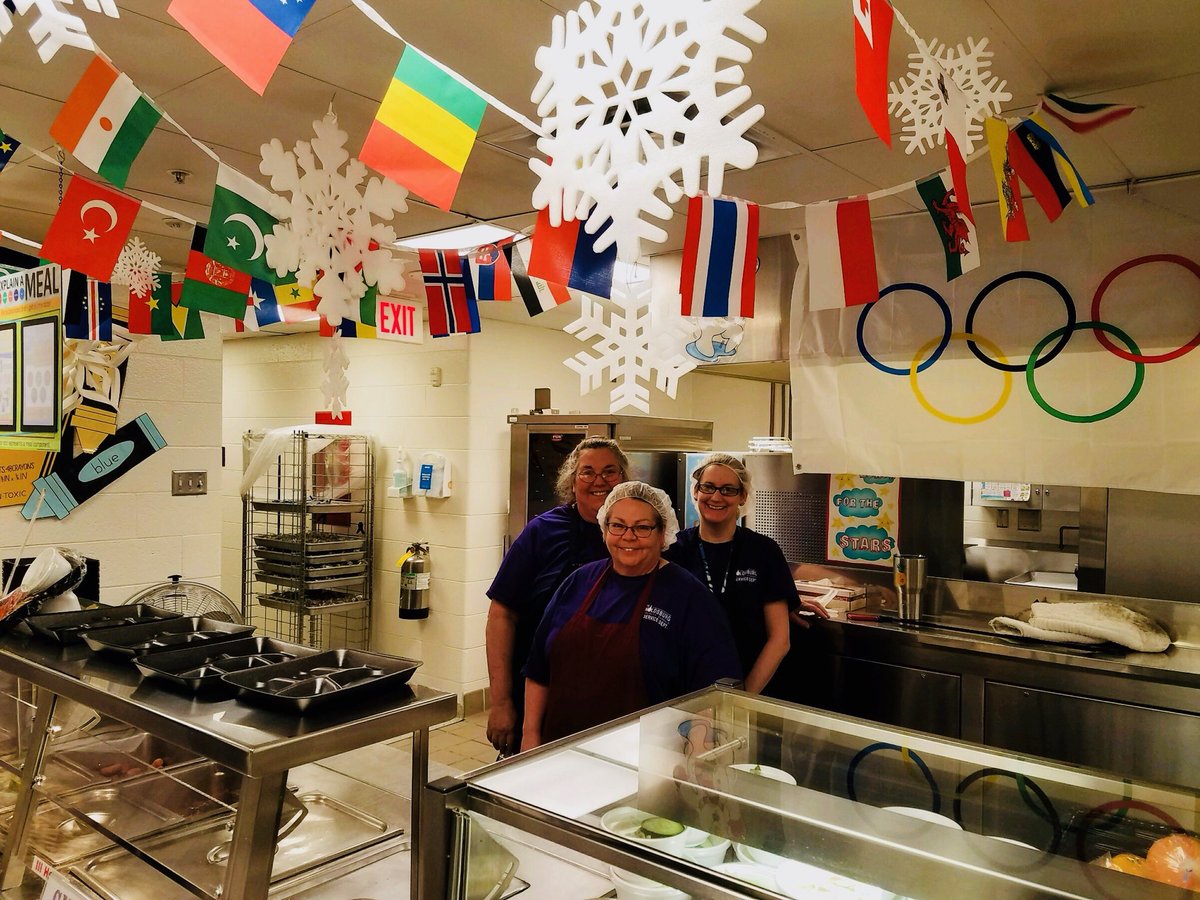 ReynFoodService's tweet photo. The @HMSTEMtigers lunch ladies celebrate the Olympics in the cafeteria. #reynproud https://t.co/nyG5O0qqDX