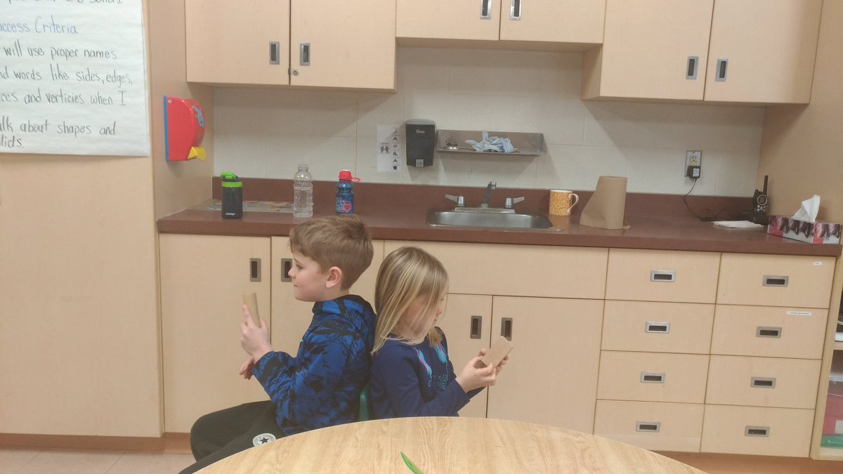 MrsColvinsClass's tweet image. The students had fun describing the properties of their 3D solids so their partners could guess which solid they were holding.