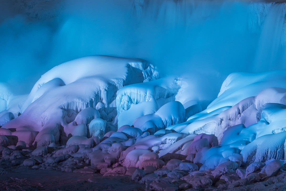 thisiscolossal's tweet photo. An Illuminated Niagara Falls Captured in a January Freeze by Adam Klekotka https://t.co/bHJEuvKO7W https://t.co/WbngR8MHo3