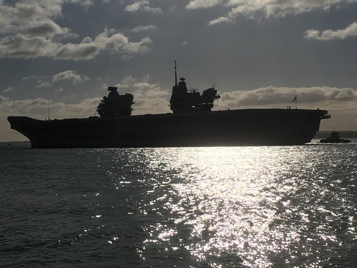 Queen Elizabeth silhouetted against the sun